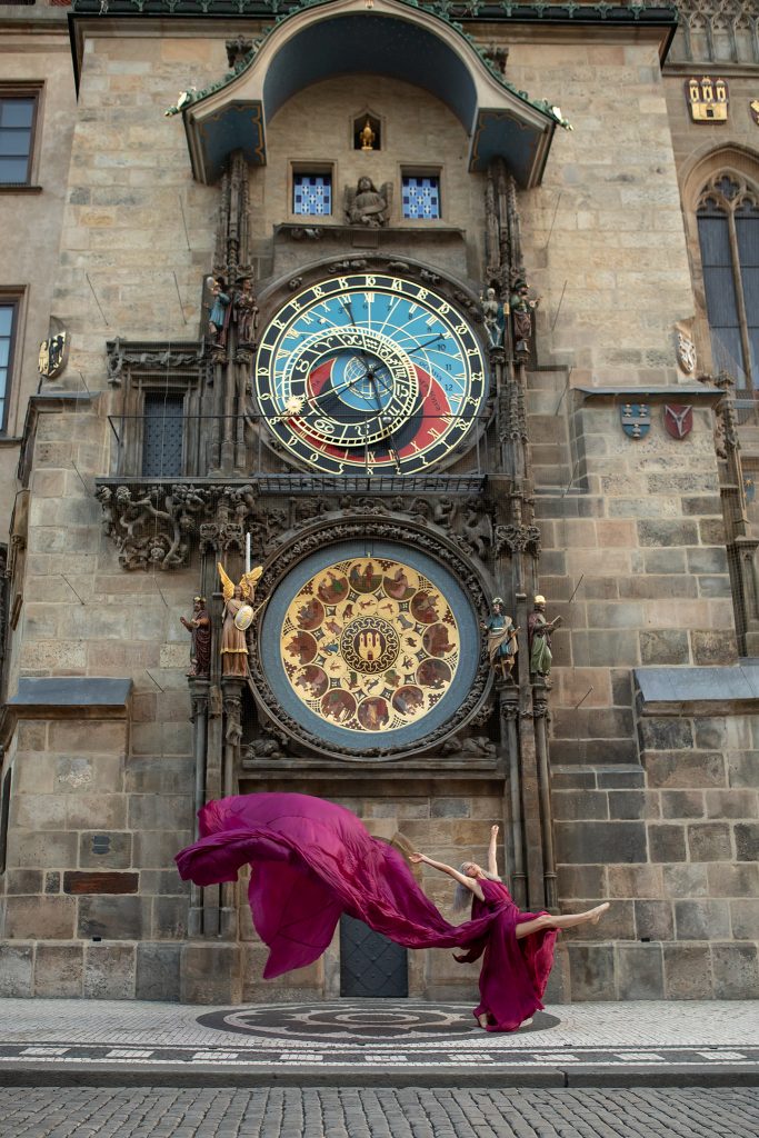 Lisa Travis in front of the medieval Astronomical Clock in Prague