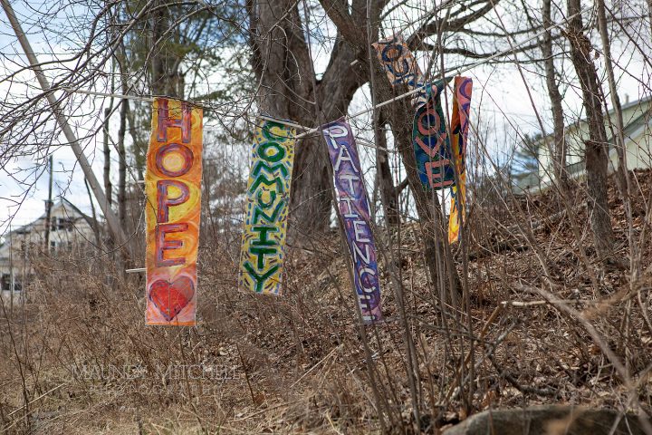 Hand-painted signs of hope by Cynthia Cutting, created to cheer her neighbors
