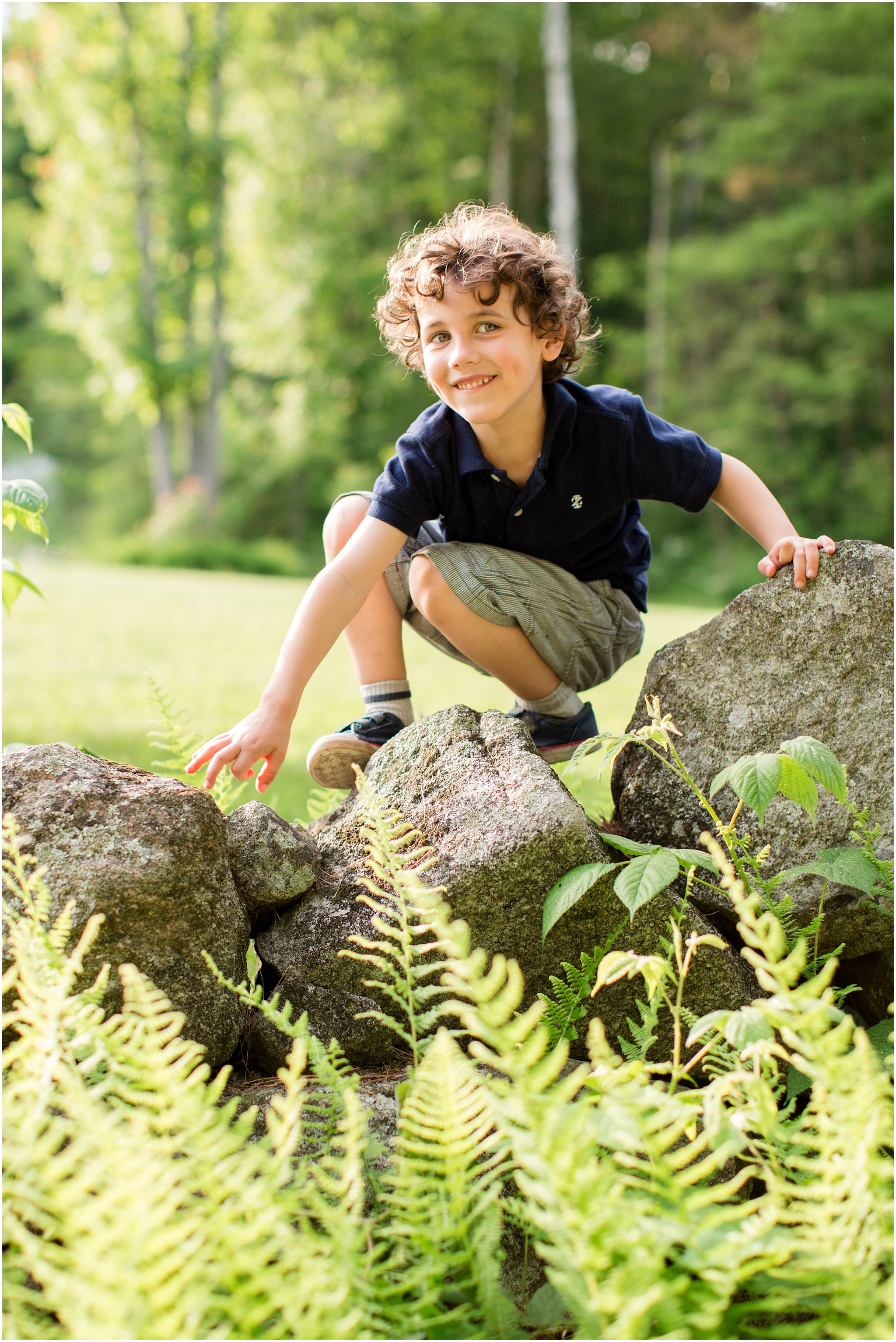 boy climbing stone wall 3