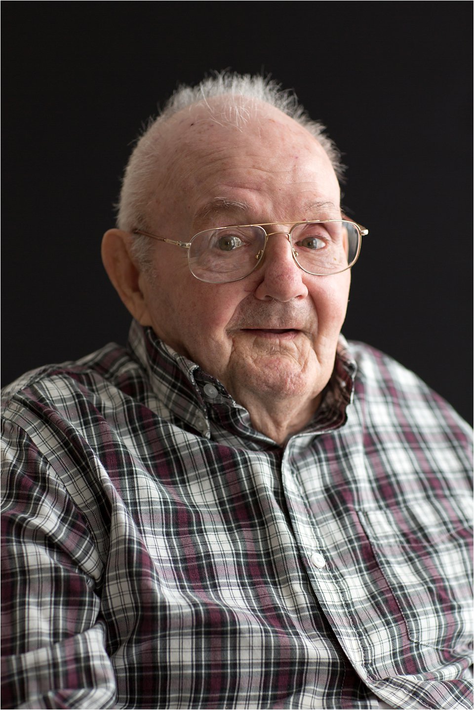 Elderly man in plaid shirt (C) Maundy Mitchell