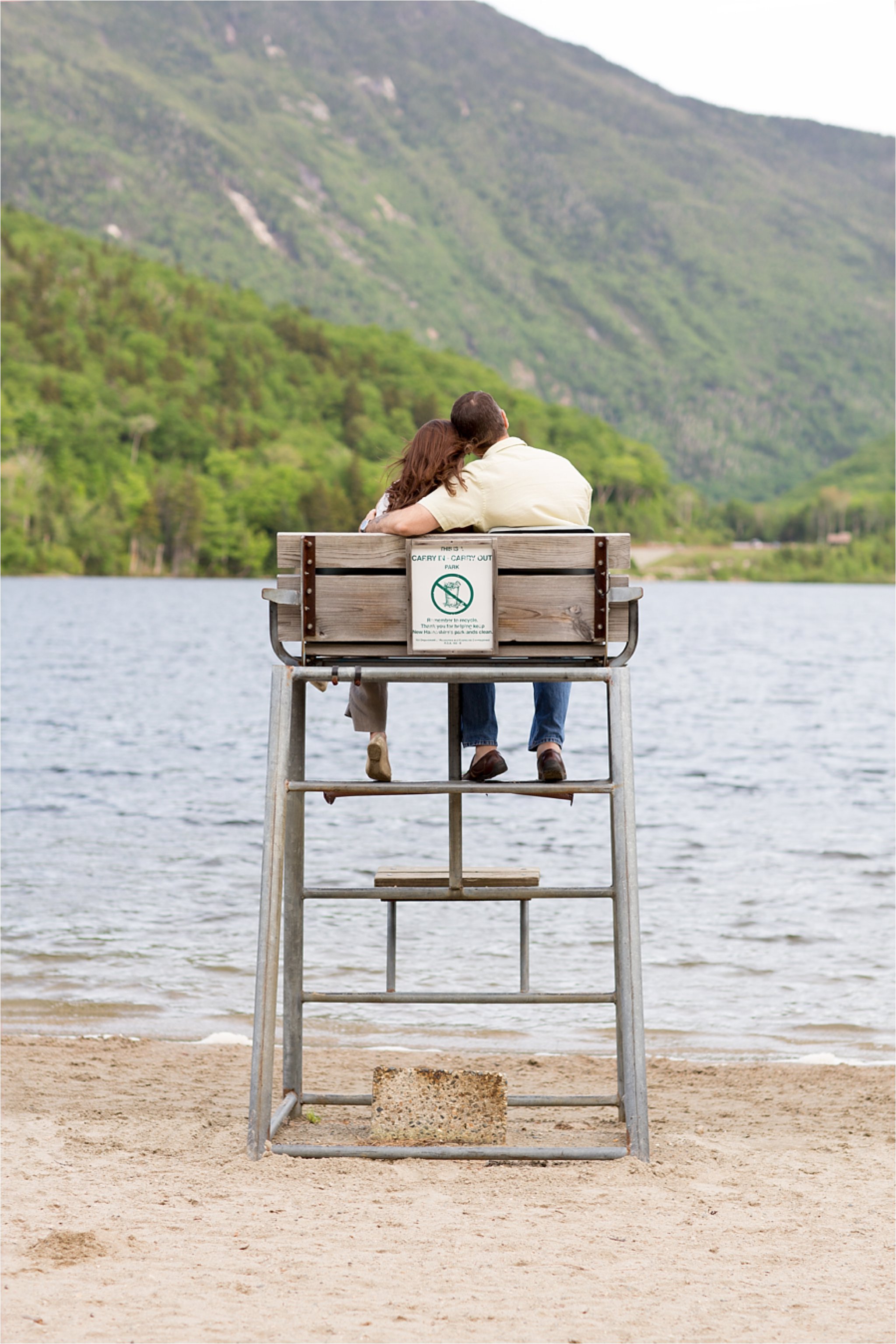 engaged couple in lifeguard chair