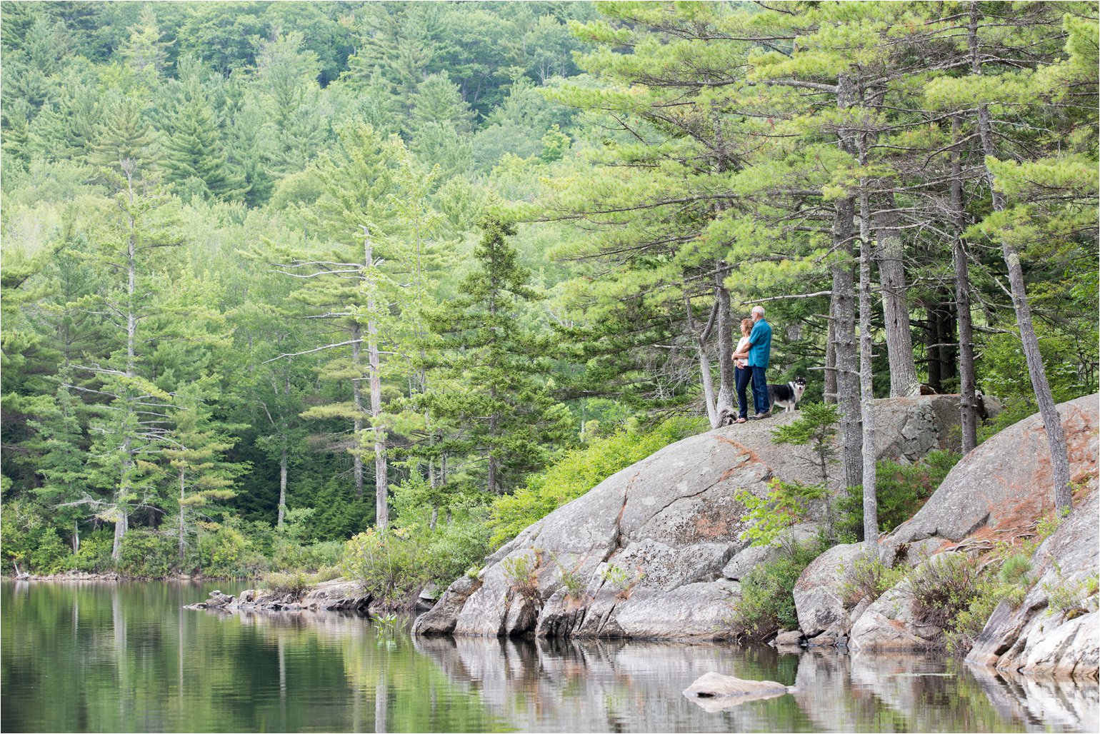 Couple and Dog Overlooking Pond (C) Maundy Mitchell