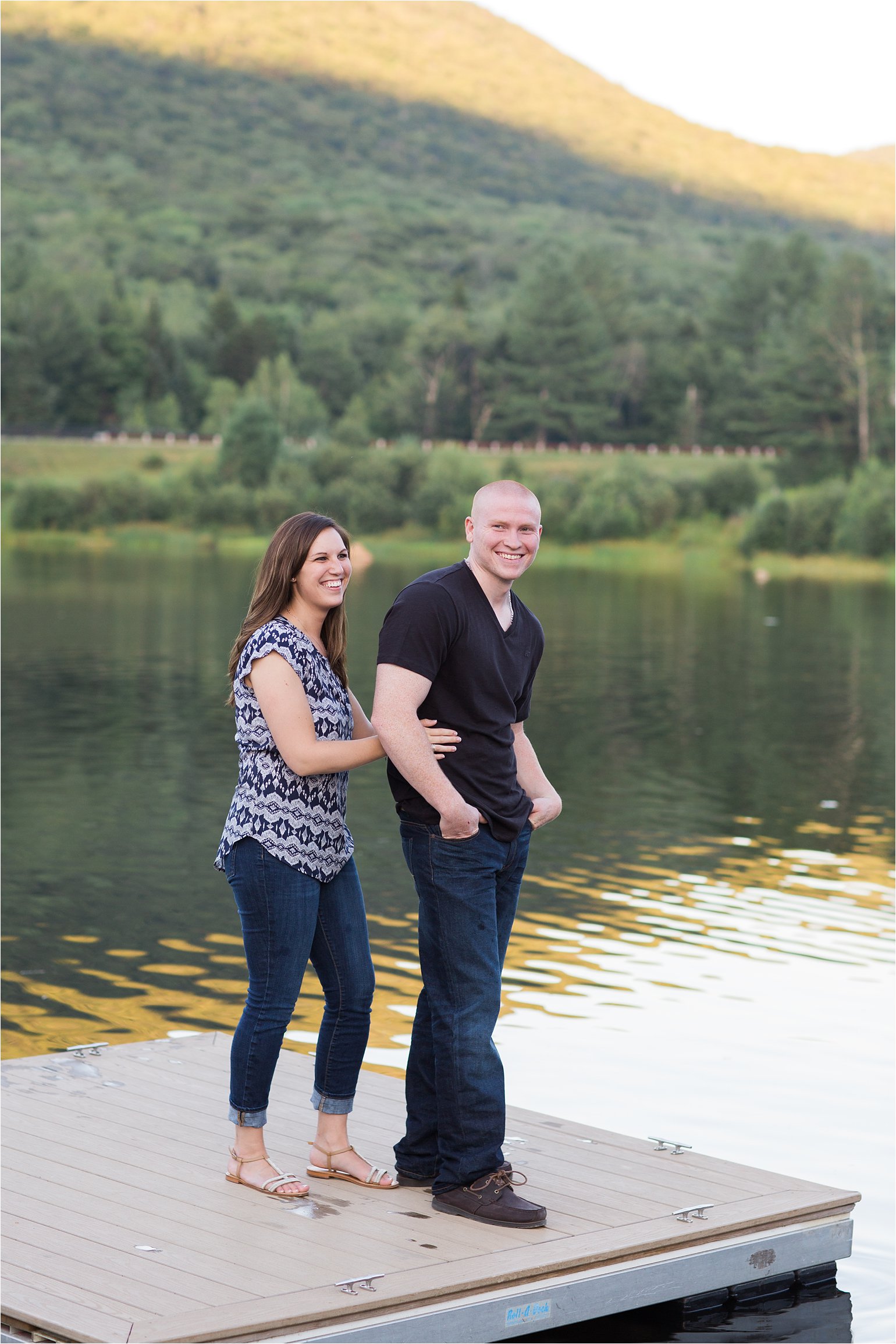 Couple laughing on dock (C) Maundy Mitchell