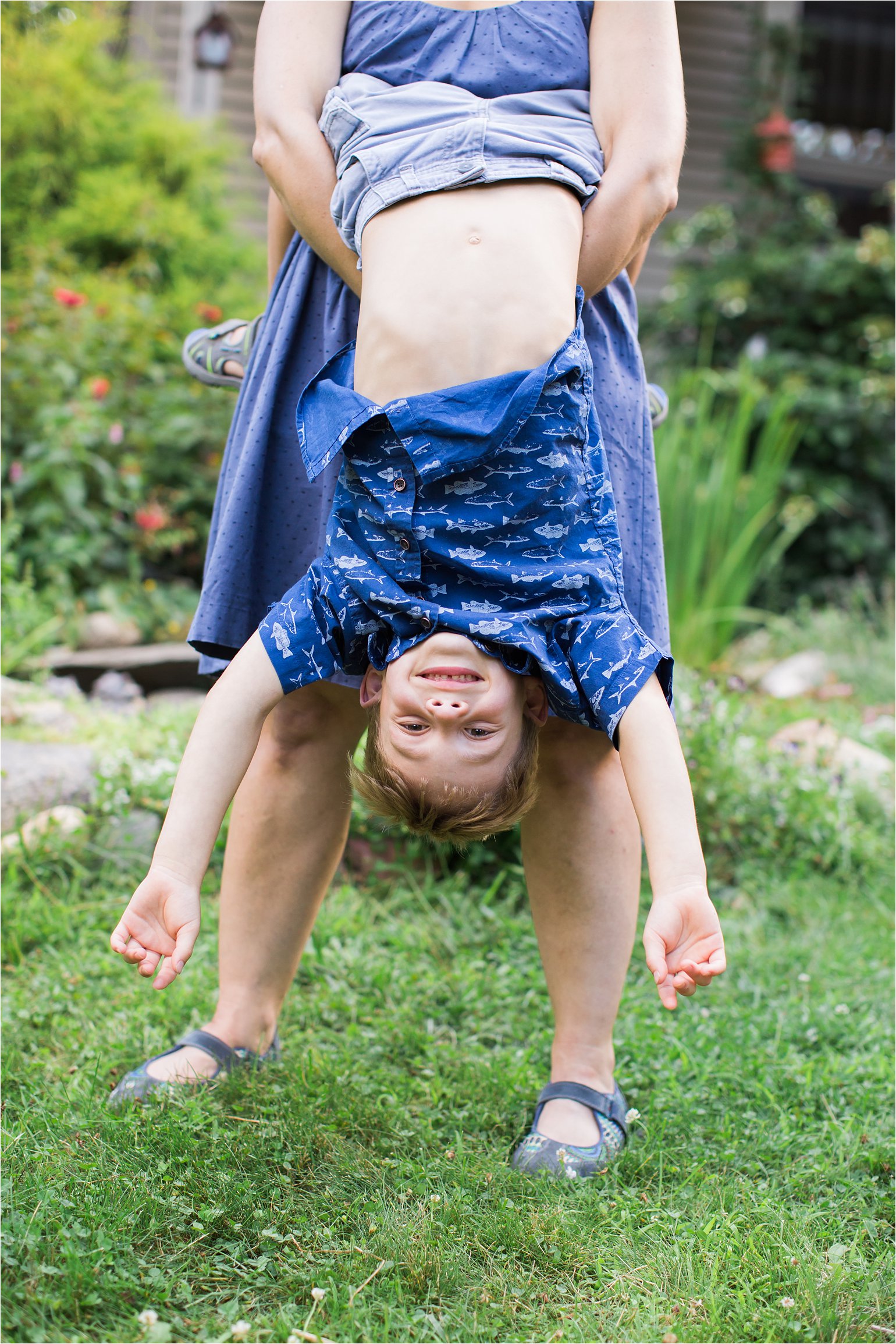 Mother Holding Son Upside-Down © 2015 Maundy Mitchell
