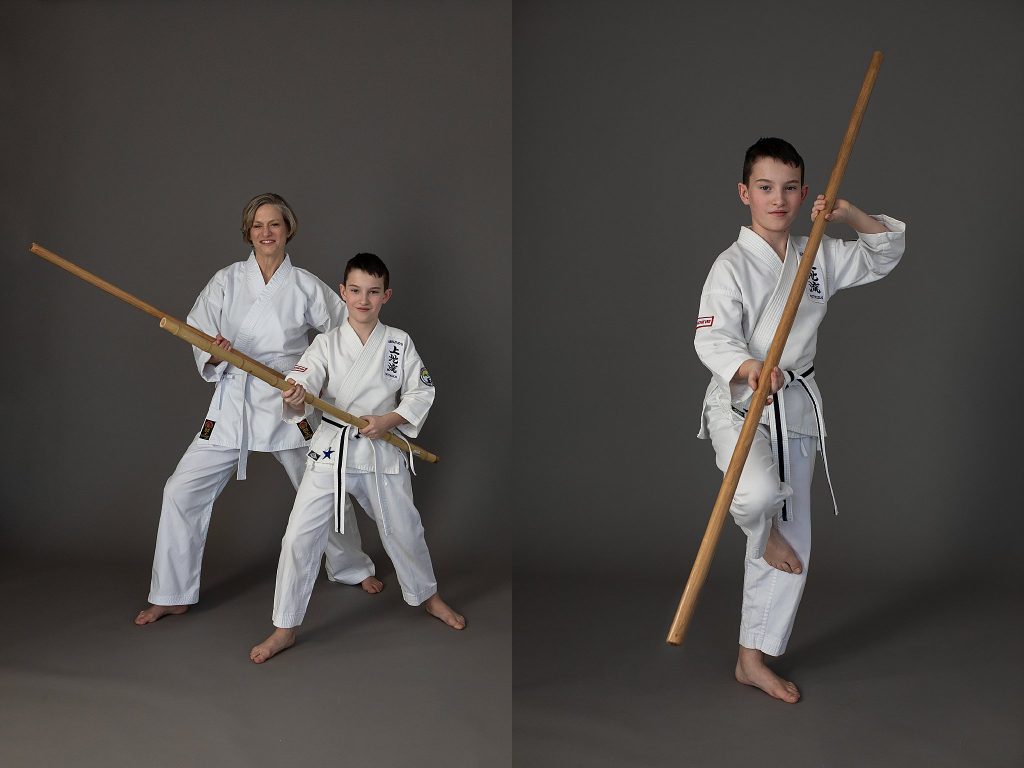 Portraits of a mother and son practicing with the bo (staff) in Uechi Ryu karate