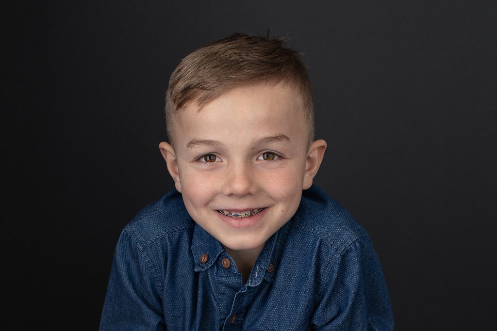 Chase smiling, showing braces