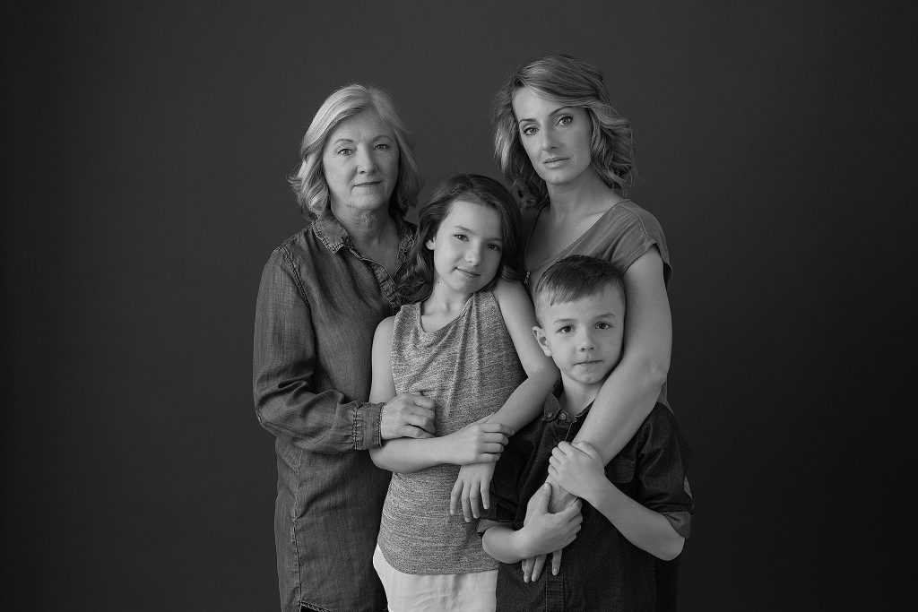 Three-generation black and white family portrait