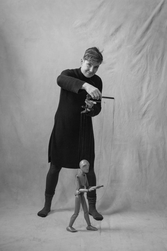 Sarah Wright with wooden marionette puppet