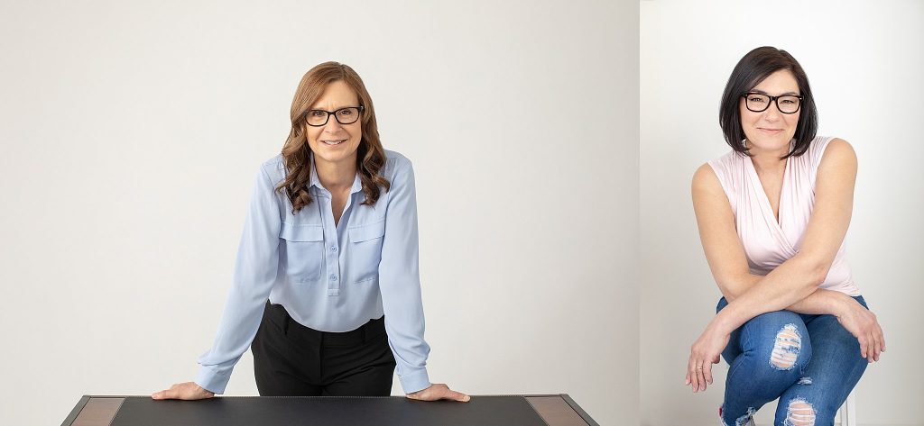 Business Branding Photos - Sandie Leaning on Desk and Lisa Seated on Stool