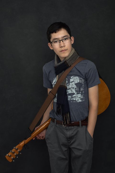 Portrait of David with his guitar, as he turns thirteen