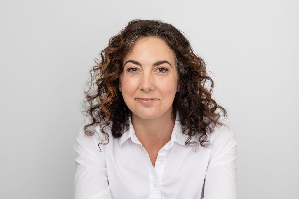 NH women's headshot - Kayte in white shirt