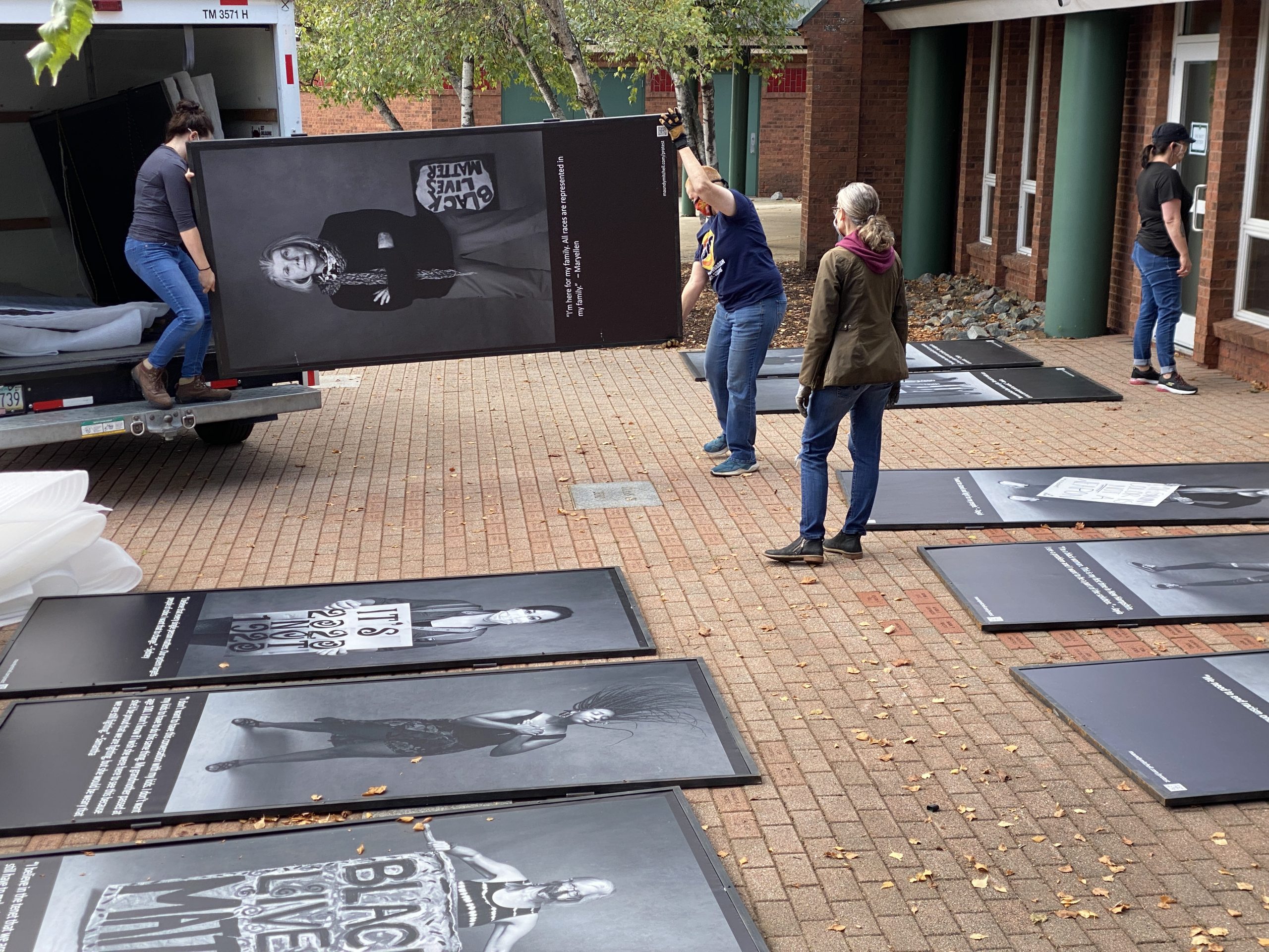 Installing Protest Portraits Exhibit at New Hampton School