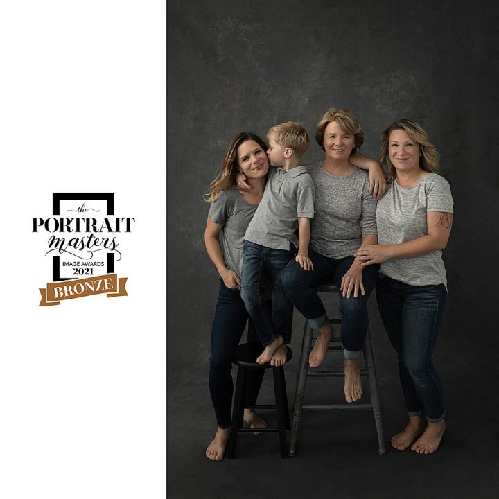 Three-generation family portrait, three women and a young boy