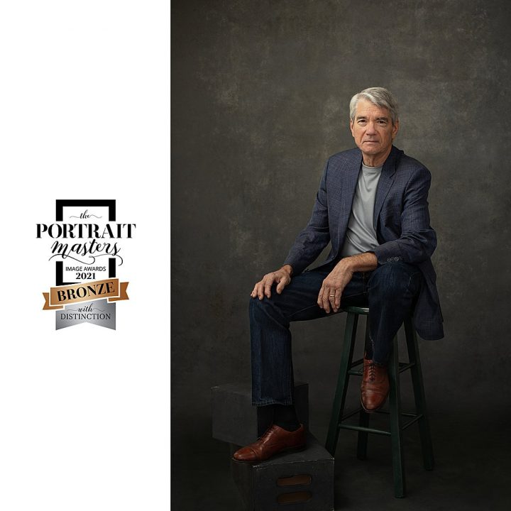 Portrait of older man with white hair