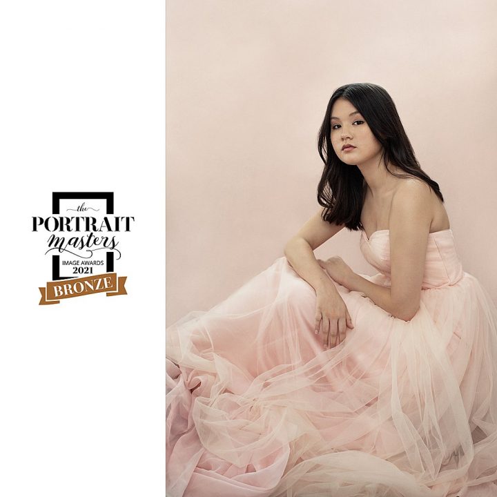 Portrait of teenage girl in a pink dress