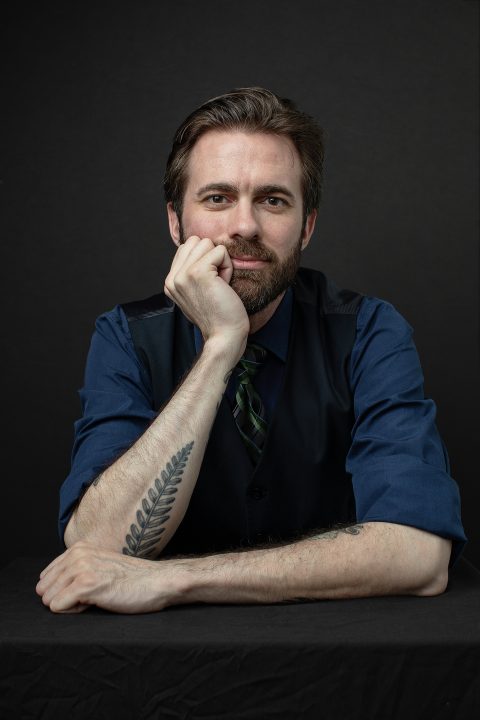 Casual headshot with tattoos