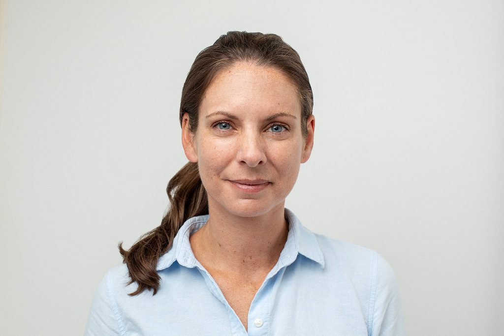 A professional headshot of a NH business owner