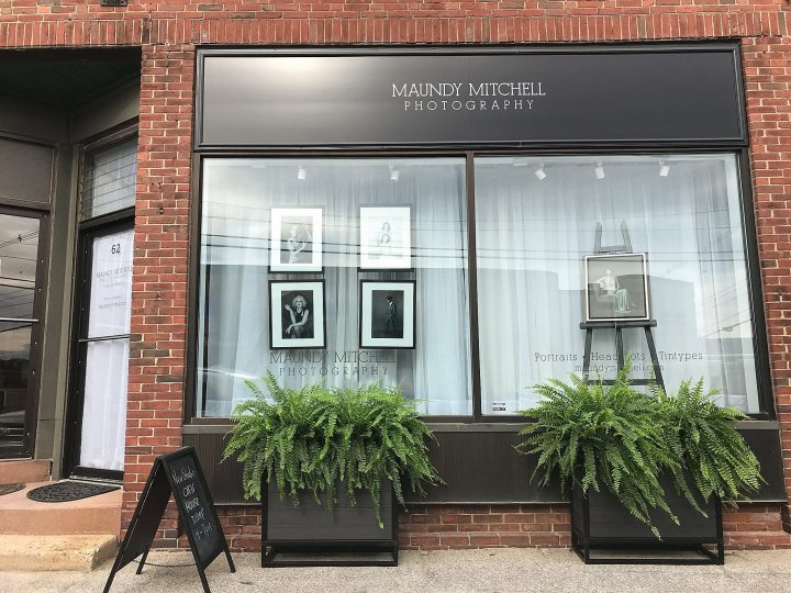 Maundy Mitchell Photography studio with large window and planters on the sidewalk