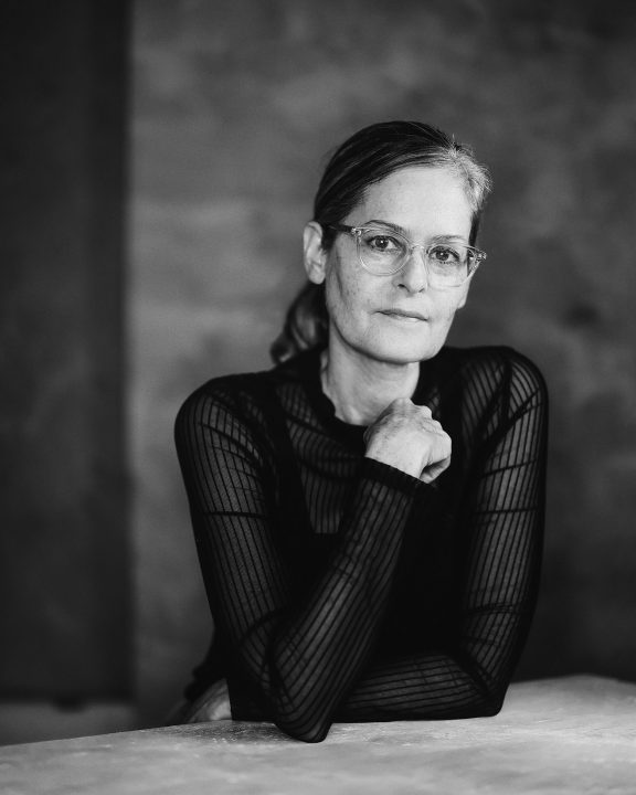 Black and white portrait of photographer Maundy Mitchell by Ivan Weiss, London