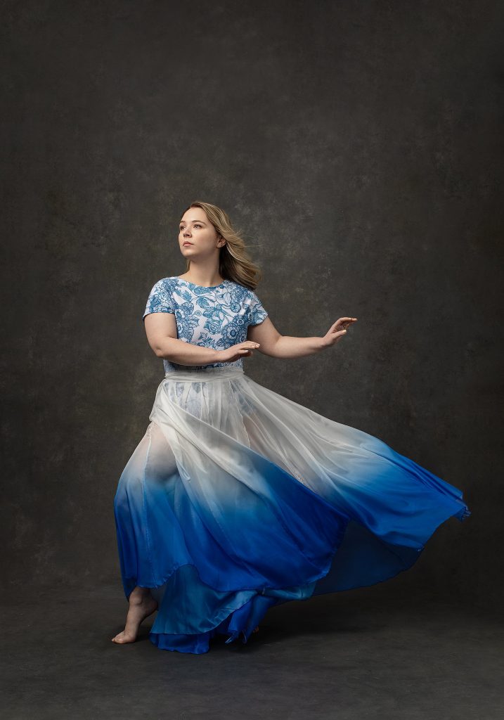 Portrait of dancer Suzanna wearing blue and white