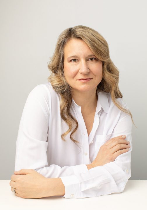 Portrait of Amanda wearing a white shirt with a white background - part of her portrait session for Extraordinary: the Over 50 Revolution at Maundy Mitchell Photography