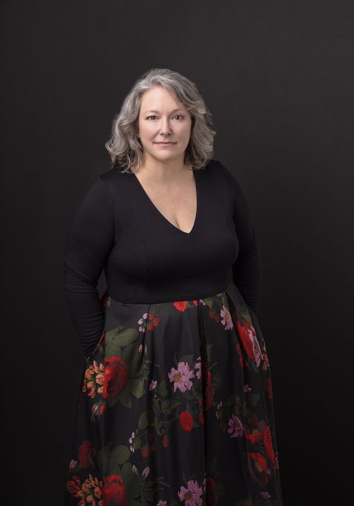 Nicole, wearing black and floral gown for her portrait experience, Extraordinary: the Over 50 Revolution