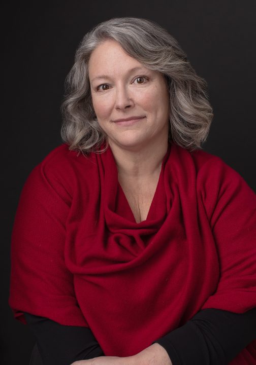 Nicole, wearing red cape for her portrait experience, Extraordinary: the Over 50 Revolution