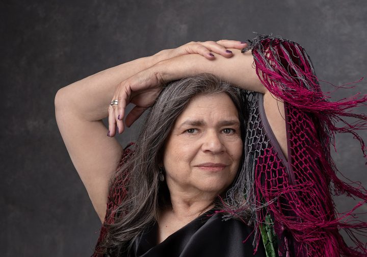 A portrait of Emilie with her arms over head, for Extraordinary: the Over 50 Revolution