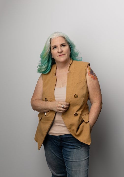 Portrait of Kim wearing a yellow vest