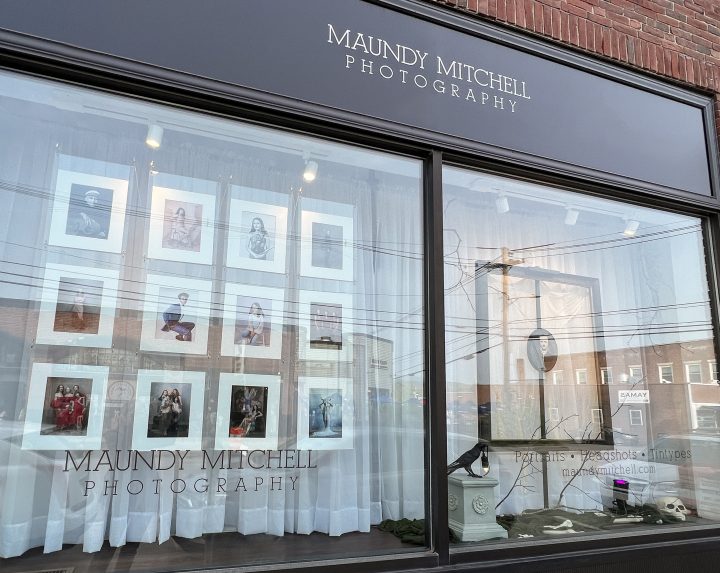 A photo of Maundy Mitchell Photography studio window display for Fall Open Studio 2023