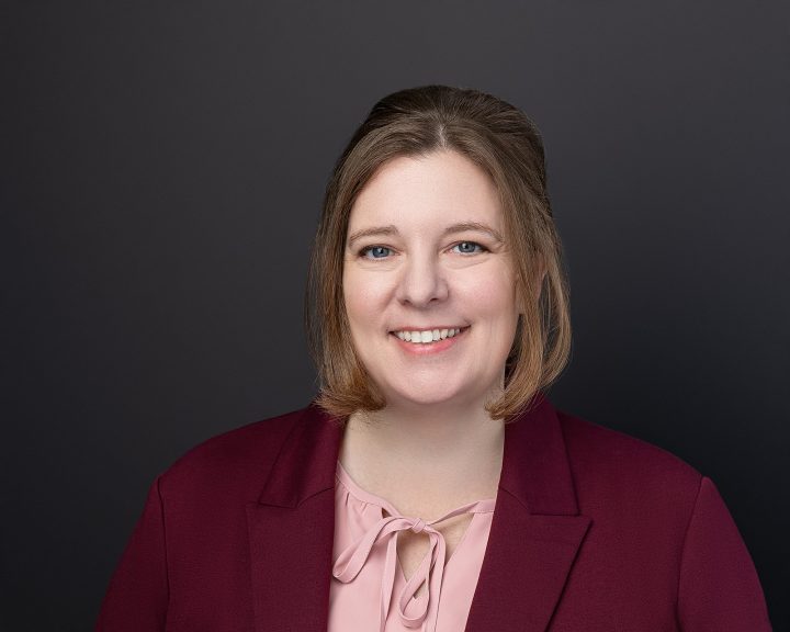 New headshot with black background for new Realtor Patty Park