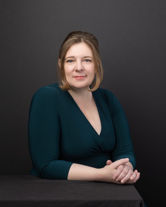 Headshot with black background for new Realtor Patty Park