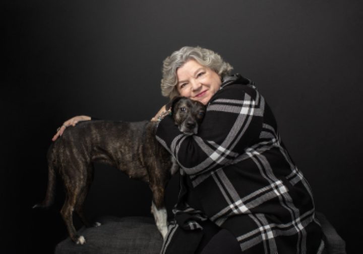 Portrait of Maria with her dog for The Over 50 Revolution
