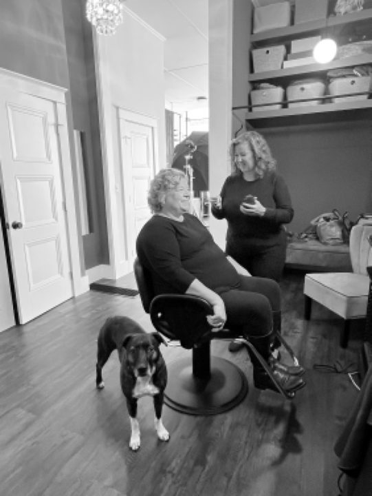 Maria, enjoying professional hair and makeup styling as part of her portrait session for The Over 50 Revolution