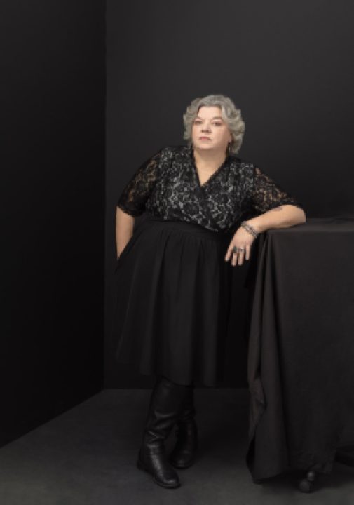 Portrait of Maria wearing lace dress for her photo session for The Over 50 Revolution