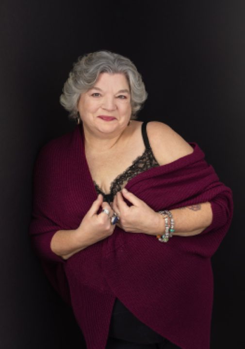 Portrait of Maria wearing red shawl for The Over 50 Revolution