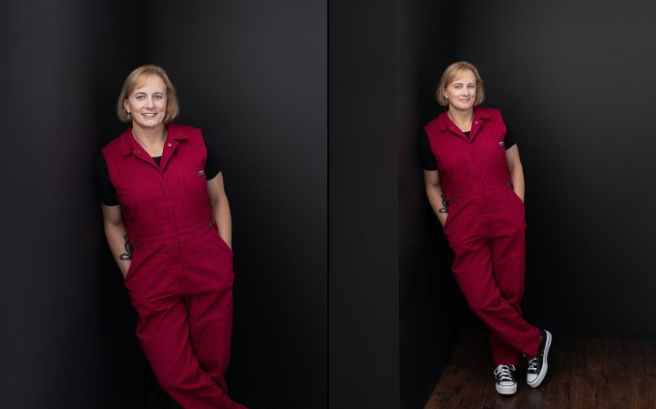 Two photos of Jess, an entrepreneur, who is leaning on a black wall and wearing a pink jumpsuit and Converse sneakers.