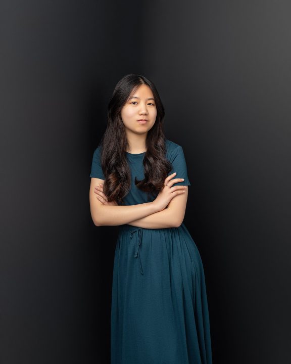 Personal branding portrait for actor Dora with black background