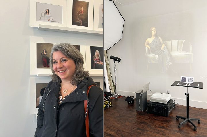A participant in The Over 50 Revolution standing in front of her portrait and a projected image on the wall.