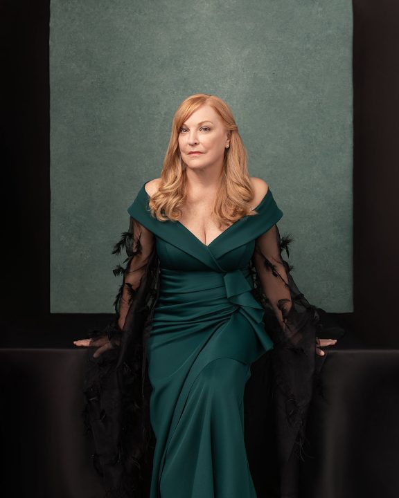A portrait of Susan wearing a green gown
