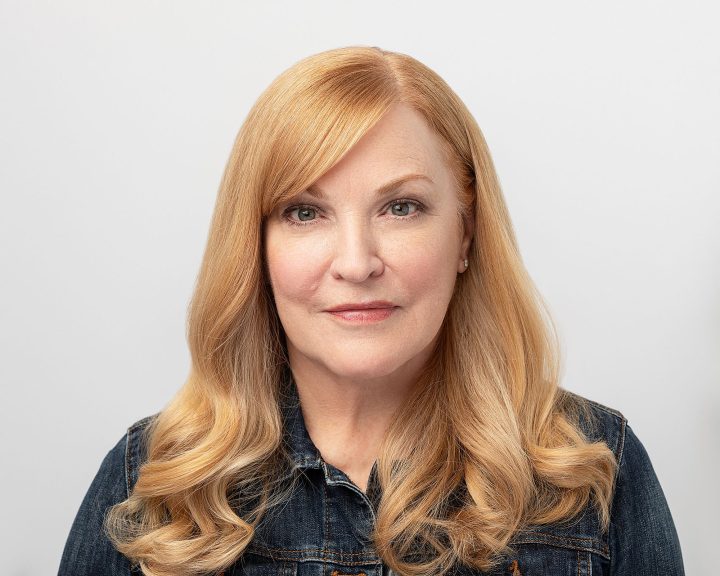 Headshot of Susan wearing a jean jacket