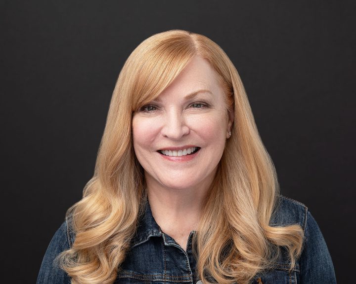 Headshot of Susan wearing a jean jacket
