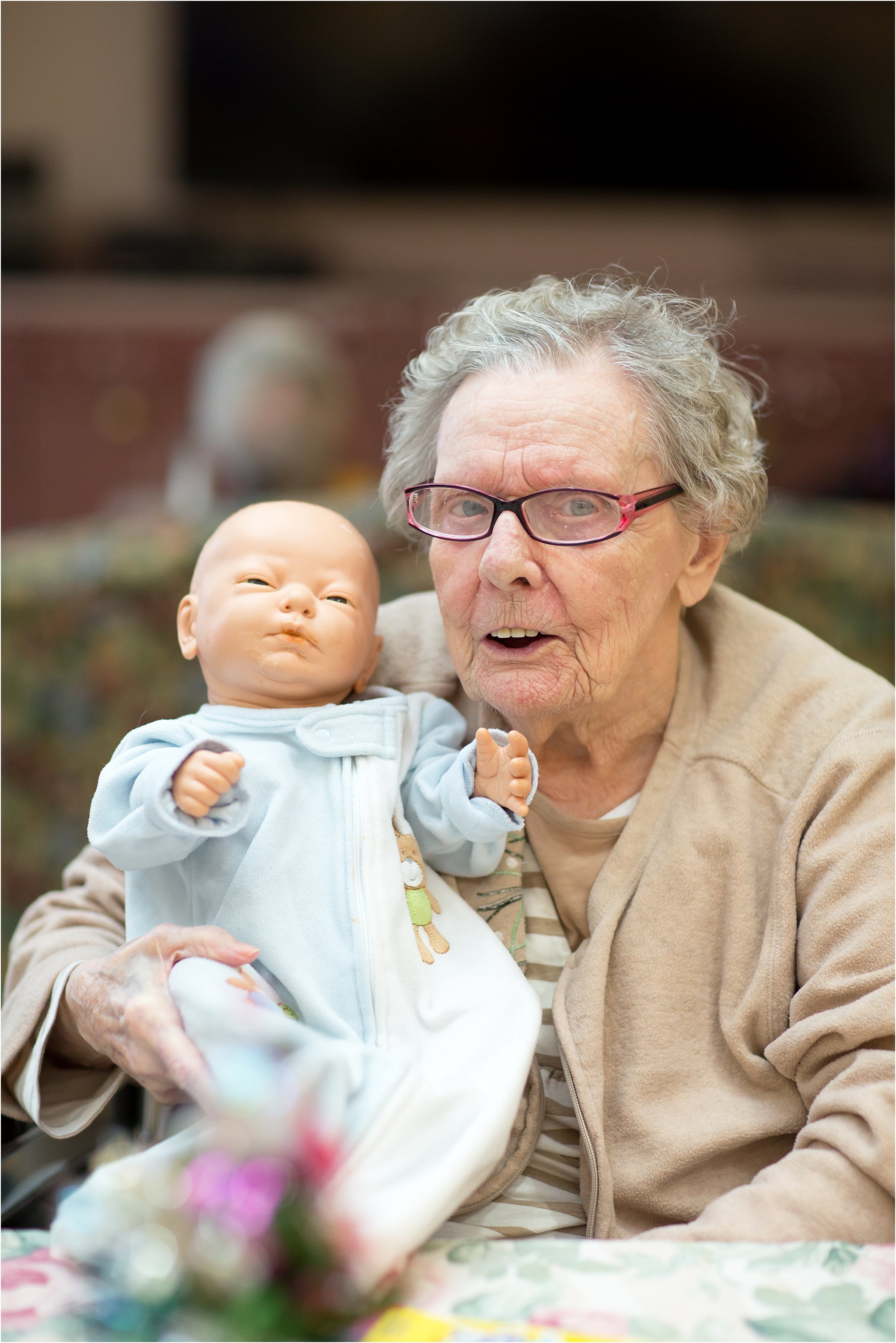 Elderly Woman with Doll