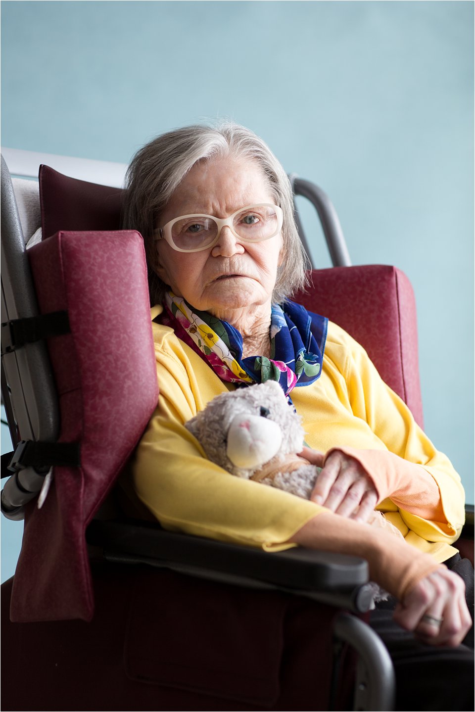 Elderly woman with stuffed animal (C) Maundy Mitchell