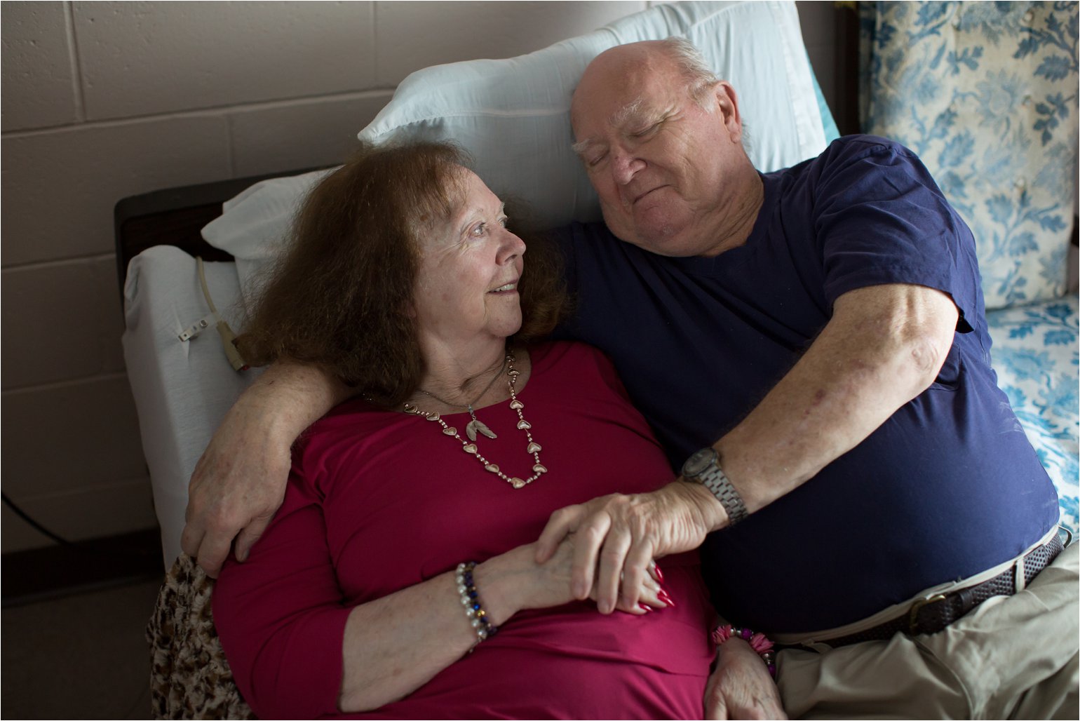 Elderly Couple Lying on Bed (C) Maundy Mitchell