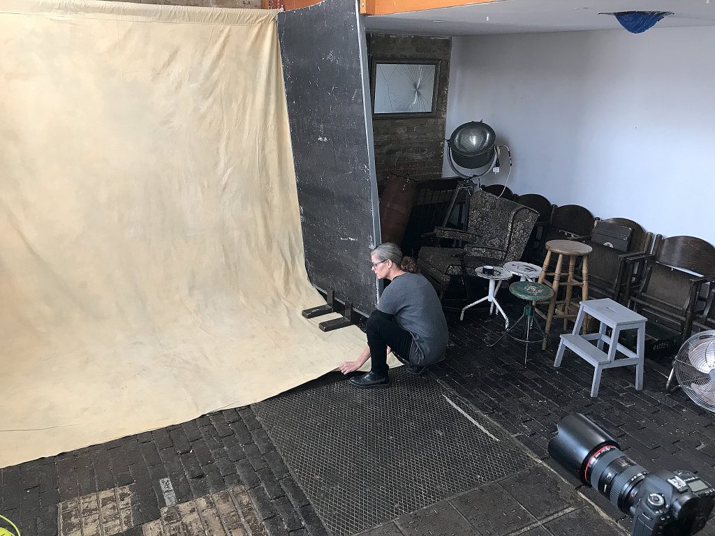 Photographer Maundy Mitchell setting up for personal project Life's Work at Espero Studio in London.