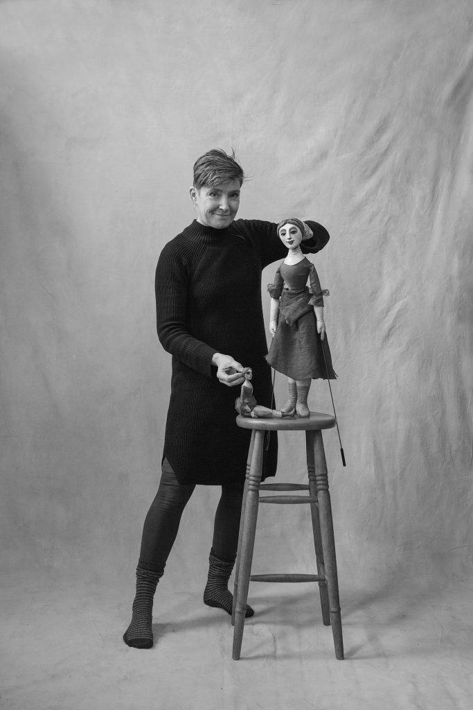 Sarah Wright with a large and a small puppet 