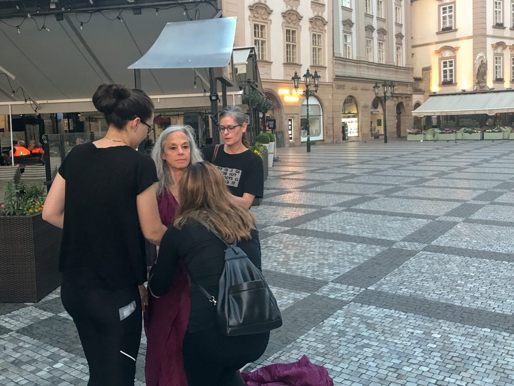 Maundy Mitchell, with assistants, helping Lisa Travis with her dress for the photo shoot.