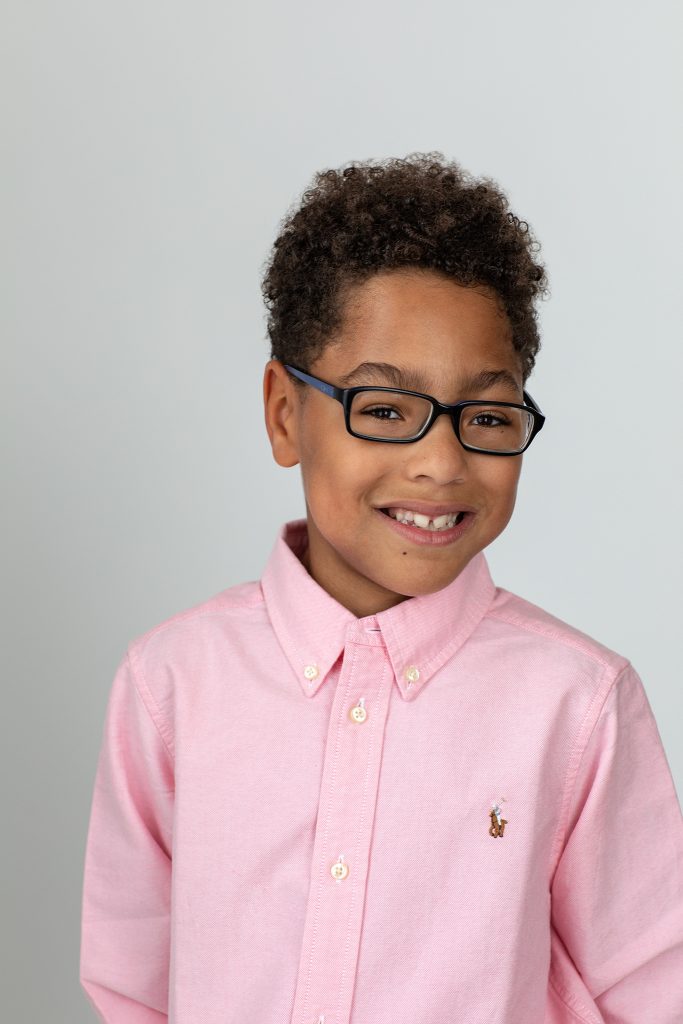 Portrait of Liam in a pink shirt