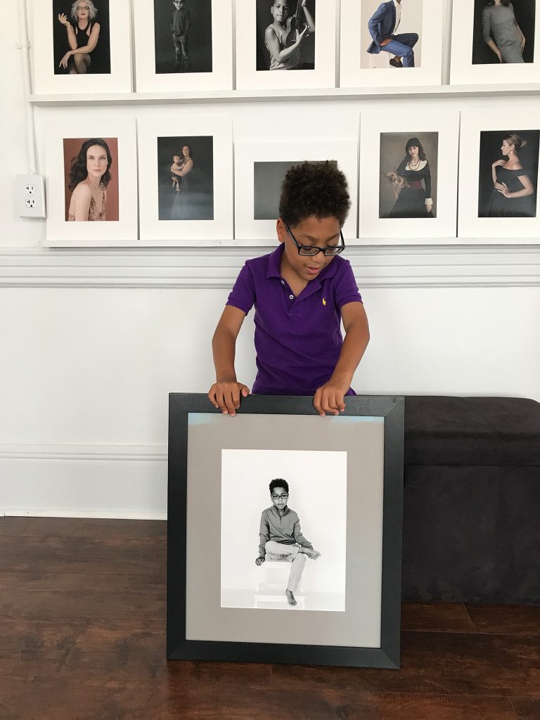 Liam with framed print of himself